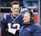  ?? Steven Senne / Associated Press ?? New England Patriots quarterbac­k Tom Brady, left, and head coach Bill Belichick speak on the sideline during the fourth quarter of an NFL football game against the New York Jets in 2018.
