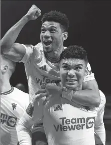  ?? REUTERS ?? Manchester United’s Casemiro (front) celebrates his late winner at Nottingham Forest with Amad Diallo on Wednesday.