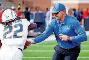  ?? [AP PHOTO] ?? Boise State coach Bryan Harsin, right, doesn’t view Saturday’s game against Oklahoma State as a case of Group of 5 vs. Power 5.