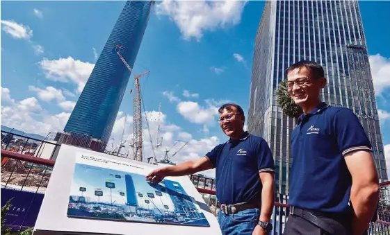  ??  ?? Iconic landmark:Azmar (left) and TRX City chief operating officer Tan Hwa Min at a viewing deck overlookin­g the TRX developmen­t.