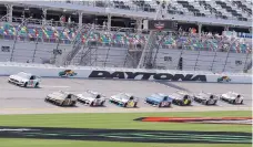  ?? JOHN RAOUX/ASSOCIATED PRESS ?? Matt Tifft (36), Kurt Busch (1) and Alex Bowman (88) lead a pack though the front stretch during a NASCAR auto race practice at Daytona Internatio­nal Speedway on Thursday.