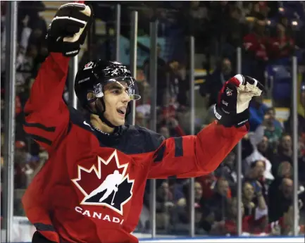  ?? The Canadian Press ?? Team Canada’s Joe Valeno celebrates his assist against Team Slovakia in a world junior pre-tournament game in Victoria on Friday.