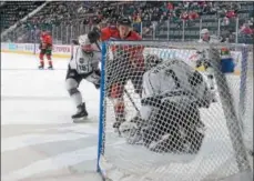  ?? PHOTO ADIRONDACK THUNDER/ANDY CAMP ?? Troy Bourke scores a goal in a recent game for the Adirondack Thunder, which won three games this weekend to earn a share of first place in the ECHL’s North Division standings.