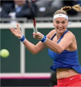  ?? AFP ?? Petra Kvitova of the Czech Republic returns to Belinda Bencic of Switzerlan­d in their Federation Cup World Group first round match in Prague. —