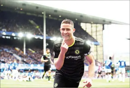  ?? PAUL ELLIS/AFP ?? Chelsea defender Gary Cahill celebrates after scoring his side’s second goal in the English Premier League match against Everton at Goodison Park in Liverpool on Sunday.