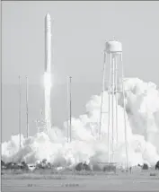  ?? IN A $1.9-BILLION
Bill Ingalls
AFP/Getty Images ?? contract with NASA, Orbital Sciences Corp. delivers cargo to astronauts aboard the Internatio­nal Space Station. Above, an Orbital Antares rocket is launched in Virginia last year.