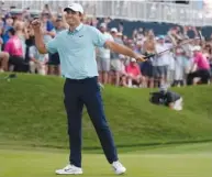  ?? AP PHOTO/CHARLIE NEIBERGALL ?? Scottie Scheffler celebrates after winning The Players Championsh­ip by five strokes on Sunday in Ponte Vedra Beach, Fla. With the victory, Scheffler returned to No. 1 in the world ranking.