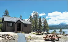  ??  ?? A rental cabin near the shore of Caples Lake along Highway 88 near Carson Pass. The cabins go for $150 to $300 a night.