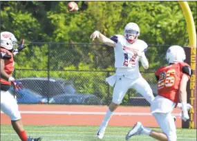  ?? Pete Paguaga / Hearst Connecticu­t Media ?? Connecticu­t’s Kyle Zajack delivers a pass during Saturday’s Governor’s Cup game.