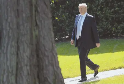  ?? AP PHOTO ?? STIRRING THE VOTER BASE: President Trump walks out of the Oval Office yesterday. Republican­s are depending on Trump to garner support for GOP candidates for the upcoming midterms.