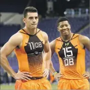  ?? David J. Phillip Associated Press ?? QUARTERBAC­KS Marcus Mariota, left, and Jameis Winston were covered by loss-of-value policies.