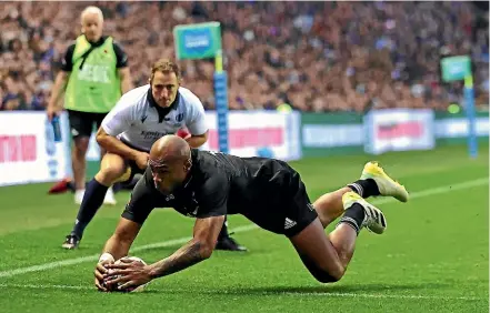  ?? GETTY IMAGES ?? Debutant winger Mark Telea scores his second try for the All Blacks on their way to beating Scotland 31-23 at Murrayfiel­d yesterday.
