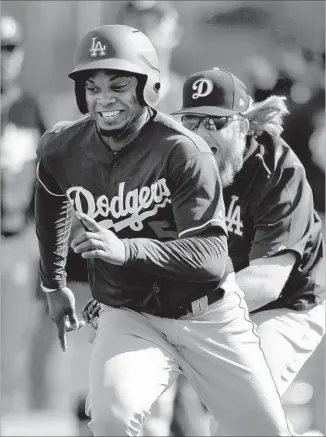  ?? Gary Coronado Los Angeles Times ?? DODGERS RELIEVER Pedro Baez, shown getting tagged out during spring-training practice this month, posted a 3.04 earned-run average with 10.1 strikeouts per nine innings in 2016.