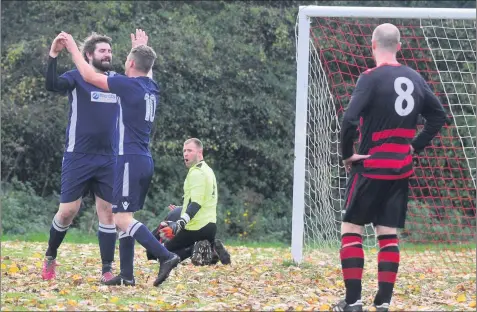  ??  ?? Nick Aitken, left, scores for Sneyd as they went on to beat Cuckoo Albion 1-0 in the Sentinel Sunday Cup.