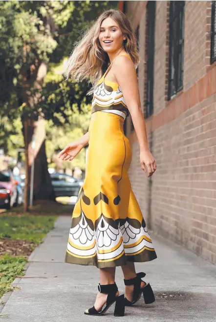  ??  ?? Coolangatt­a model Zoe Cross wearing an Alice McCall dress yesterday. Picture: TIM HUNTER