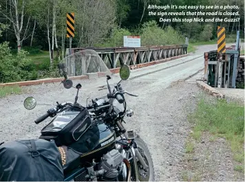  ??  ?? Although it’s not easy to see in a photo, the sign reveals that the road is closed. Does this stop Nick and the Guzzi?