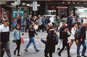  ?? BLOOMBERG PIC ?? Australia’s labour market has enjoyed a job surge since early last year, sending the unemployme­nt rate lower to 5.3 per cent from a peak of 6.4 per cent in 2014.