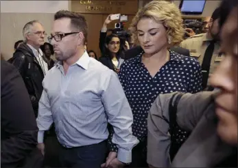  ??  ?? Brad Steinle, the brother of Kate Steinle (left), and his wife Amy walk to a courthouse in San Francisco on Monday. A trial begins this week for Jose Ines Garcia Zarate, a Mexican man who set off a national immigratio­n debate after he fatally shot Kate...