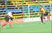  ??  ?? BPCL’s Jarnail Singh (left) makes an attempt at the PNB goal during their semi-final match on Tuesday.