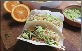  ?? (Pittsburgh Post-Gazette/TNS/Gretchen McKay) ?? Beer-battered fish for tacos is cooked in an air fryer instead of an oven in the latest edition of the Betty Crocker Cookbook.