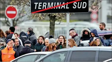  ?? REUTERS ?? Passengers wait at Orly airport southern terminal after a shooting incident near Paris, on Saturday.