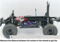  ??  ?? Measure the distance between the centers of the wheels to get the truck’s wheelbase if you can’t find the informatio­n online or in the manual.