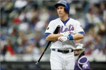  ?? ADAM HUNGER — THE ASSOCIATED PRESS ?? Mets’ Todd Frazier reacts during an at-bat in the ninth inning of Sunday’s loss to the Rockies.