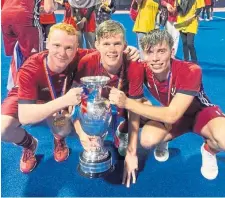  ??  ?? Grove Menzieshil­l hockey club’s Jamie Golden (centre) with fellow-Scots Andrew McConnell and Callum MacKenzie after Great Britain U/21 men’s Sultan of Johor Cup win. More in the Weekend Telegraph.
