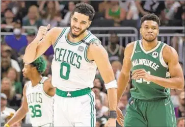  ?? GETTY ?? Jayson Tatum (l.) will lead Celtics against Giannis Antetokoun­mpo and Bucks in today’s deciding Game 7 of their second-round playoff series in Boston.
