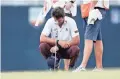  ?? MICHAEL WYKE/AP ?? Lanto Griffin cries as he rests his head on his putter after winning the Houston Open on Sunday. Griffin credits PGA profession­al and personal mentor Steve Prater for his success.