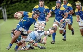  ??  ?? St Peter’s College hooker Dhynzel Pritchard, left, breaks up the sideline against Napier Boys’ High School at the national secondary schools top four rugby championsh­ips final.