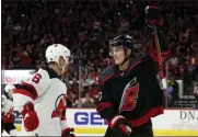  ?? KARL B DEBLAKER - THE ASSOCIATED PRESS ?? Carolina Hurricanes’ Andrei Svechnikov (37), of Russia, celebrates his goal as he skates by New Jersey Devils’ Andy Greene (6) during the second period of an NHL hockey game in Raleigh, N.C., Friday, Feb. 14, 2020.