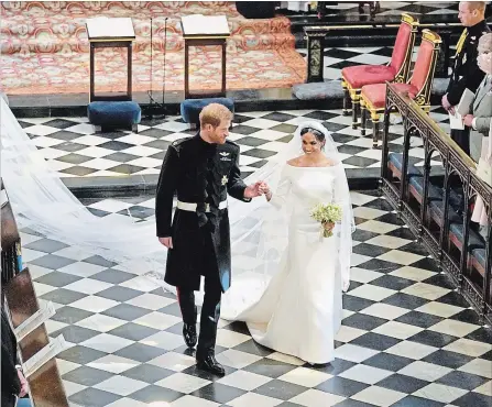  ?? WPA POOL GETTY IMAGES ?? Man and wife: Prince Harry and Meghan Markle depart after their wedding in St George's Chapel.