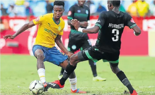  ?? Picture: BackpagePi­x ?? Themba Zwane, of Mamelodi Sundowns, is challenged by Ronald Pfumbidzai of Bloemfonte­in Celtic during yesterday’s clash in Pretoria.