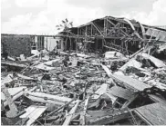  ?? JOSE JIMENEZ/GETTY ?? Debris litters the foundation of a leveled building Friday at Marsh Harbor Port in Grand Abaco Island in the Bahamas.