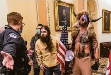  ?? Manuel Balce Ceneta / Associated Press ?? Jacob Chansley (right) yells inside the Capitol during the siege Jan. 6 by supporters of former President Donald Trump.