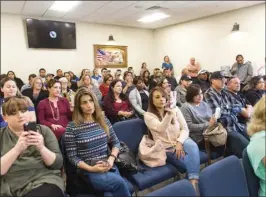  ??  ?? Concerned Imperial High School parents sit in attendance during a press conference Tuesday afternoon at the city of Imperial Council Chambers regarding a school threat made at Imperial High. VINCENT OSUNA PHOTO