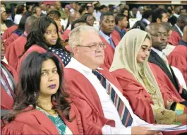  ??  ?? Despite coping with the death of her son, Patricia Govender, seated in front among other students, has realised her dream of graduating with a PhD.