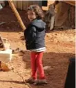  ?? JOSEPH EID/AFP/GETTY IMAGES ?? A Syrian refugee girl at a makeshift camp by Taybeh village, in Lebanon’s eastern Bekaa Valley.