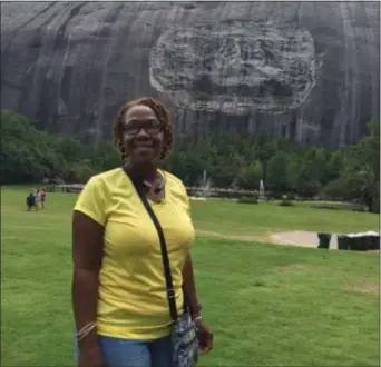  ?? STEVE HENDRIX — WASHINGTON POST VIA AP ?? Naomi Jones, a frequent picknicker at Stone Mountain, said she has mostly ignored park’s massive monument to Confederat­e leaders. Now she wants it removed. the