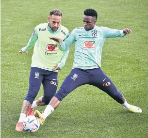  ?? REUTERS ?? Brazil’s Neymar, left, and Vinicius Jr attend a training session in Turin.