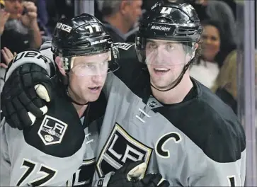  ?? Luis Sinco Los Angeles Times ?? ANZE KOPITAR, right, congratula­ting Jeff Carter for scoring, had only 12 goals and 52 points last season for the Kings. “Honestly I don’t know how to really explain it,” he says. “It just wasn’t my year really.”