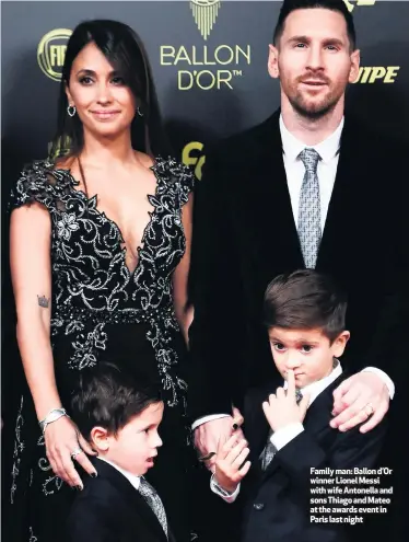  ??  ?? Family man: Ballon d’Or winner Lionel Messi with wife Antonella and sons Thiago and Mateo at the awards event in Paris last night