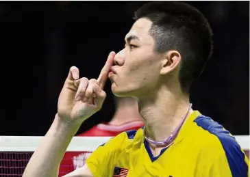  ??  ?? Muted celebratio­n: Lee Zii Jia beat Japan’s Riichi Takeshita 21-17, 16-21, 21-11 in the Taiwan Open final yesterday.