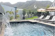  ??  ?? Tranquil setting: The Oude Schuur Guesthouse in Hermanus has six guest rooms with stunning mountain and garden views. It will go on auction on November 7.