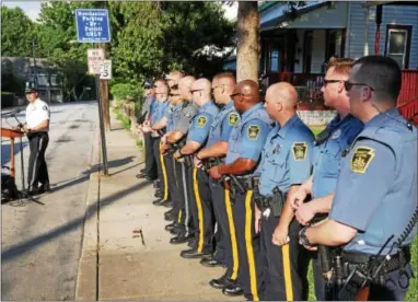  ?? FRAN MAYE – DIGITAL FIRST MEDIA ?? Kennett Township Police Chief Lydell Nolt speaks at the National Night Out ceremony in Kennett Square Tuesday as officers from both Kennett Township and Kennett Square stand in unison.