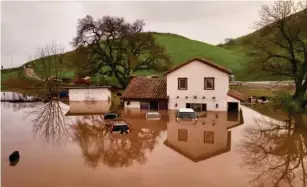  ?? (AFP/Getty) ?? Heavy rainfall is a direct consequenc­e of this upper ocean heat