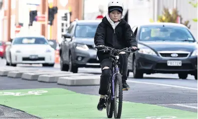  ?? PHOTO: PETER MCINTOSH ?? Degree of separation . . . A cyclist rides on the Castle St cycle lane.