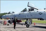  ?? / Doug Walker ?? Captain Cody Wilton prepares to get out of the cockpit of the U.S. Air Force A-10 Thunderbol­t after a practice session for the Wings Over North Georgia Air Show Friday afternoon. The show will be held at Richard Russell Regional Airport in Rome Saturday and Sunday.