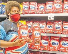  ?? Picture: SUPPLIED ?? Taina Naulivou of Vakabuli Village, Lautoka with Omo laundry detergent powder at Extra Supermarke­t.